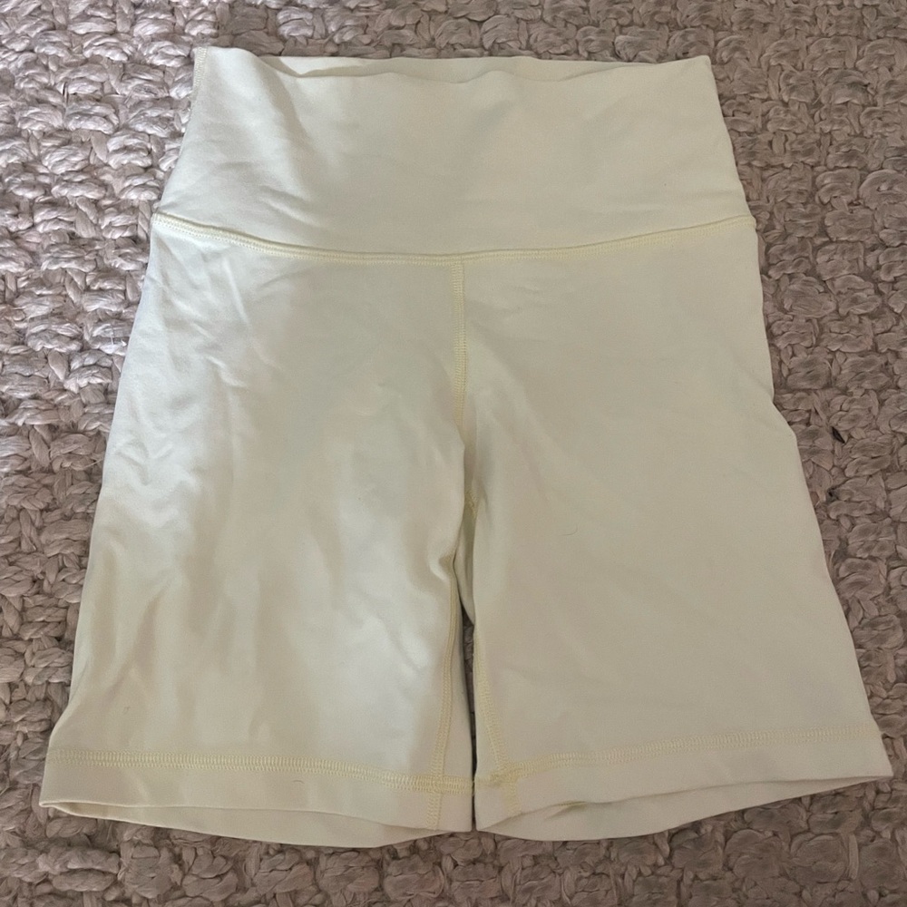 Aritzia TNA butter yellow yoga shorts